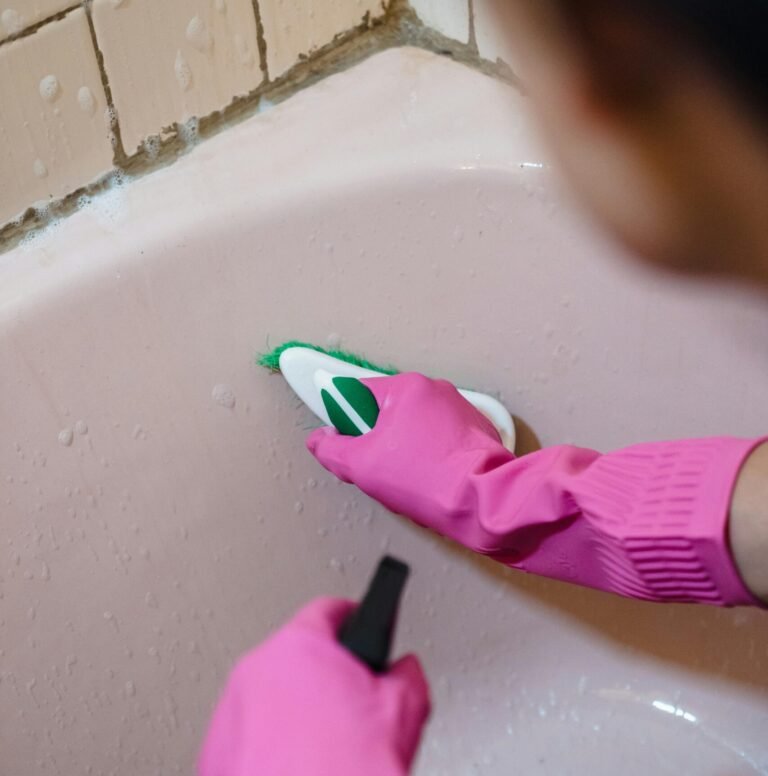 Cleaning a bathtub as part of deep cleaning services in Dallas