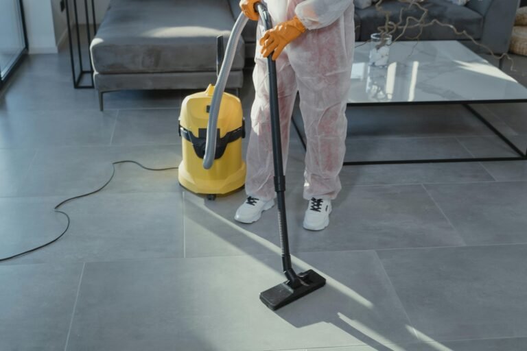 Person cleaning the floor, representing Mess2Miracles house cleaning services in Frisco, Texas